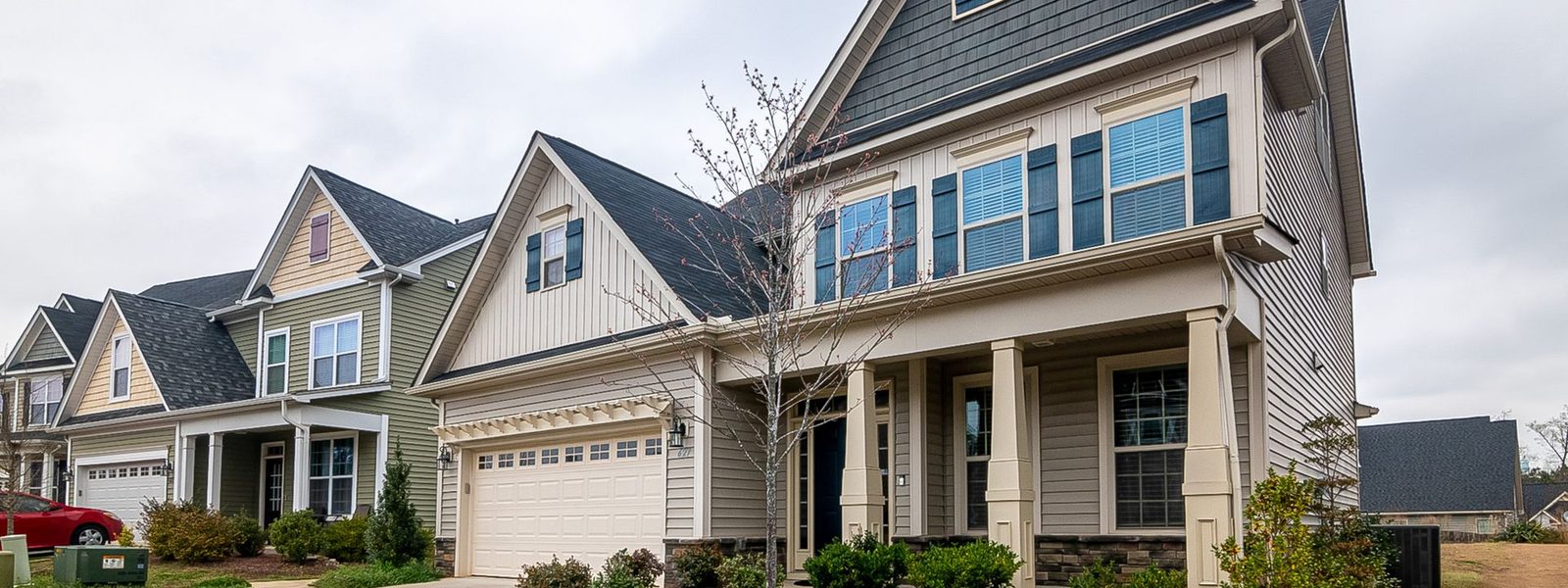 A row of suburban family homes on a bright day
