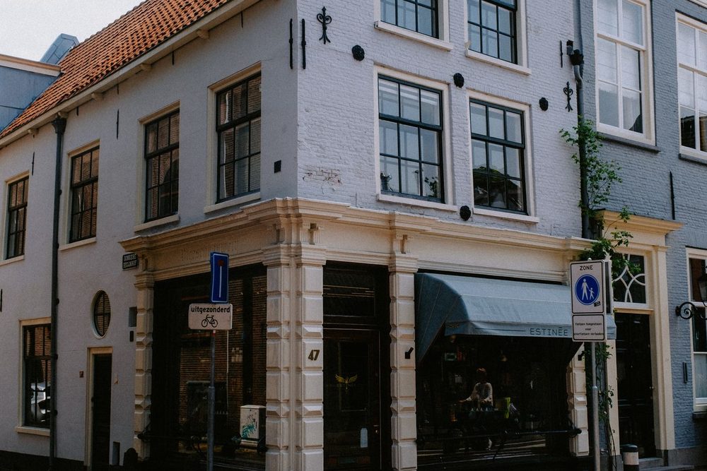 A corner building with shops at street level and offices above